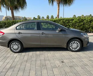 Suzuki Ciaz 2023 car hire in the UAE, featuring ✓ Petrol fuel and 130 horsepower ➤ Starting from 80 AED per day.