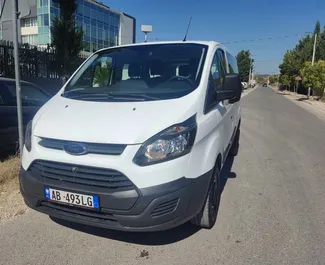 Front view of a rental Ford Tourneo Custom in Tirana, Albania ✓ Car #7450. ✓ Manual TM ✓ 0 reviews.
