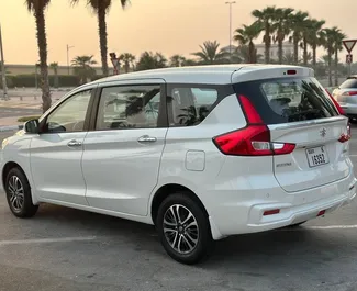 Suzuki Ertiga 2023 car hire in the UAE, featuring ✓ Petrol fuel and  horsepower ➤ Starting from 237 AED per day.