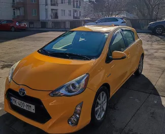 Front view of a rental Toyota Prius C in Tbilisi, Georgia ✓ Car #9303. ✓ Automatic TM ✓ 0 reviews.