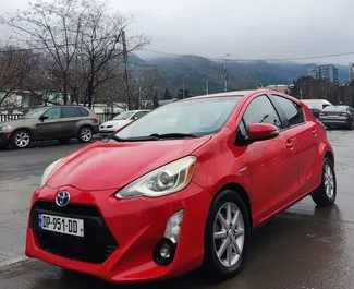 Front view of a rental Toyota Prius C in Tbilisi, Georgia ✓ Car #9302. ✓ Automatic TM ✓ 0 reviews.