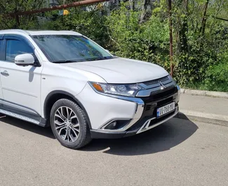 Front view of a rental Mitsubishi Outlander Xl in Tbilisi, Georgia ✓ Car #9706. ✓ Automatic TM ✓ 0 reviews.